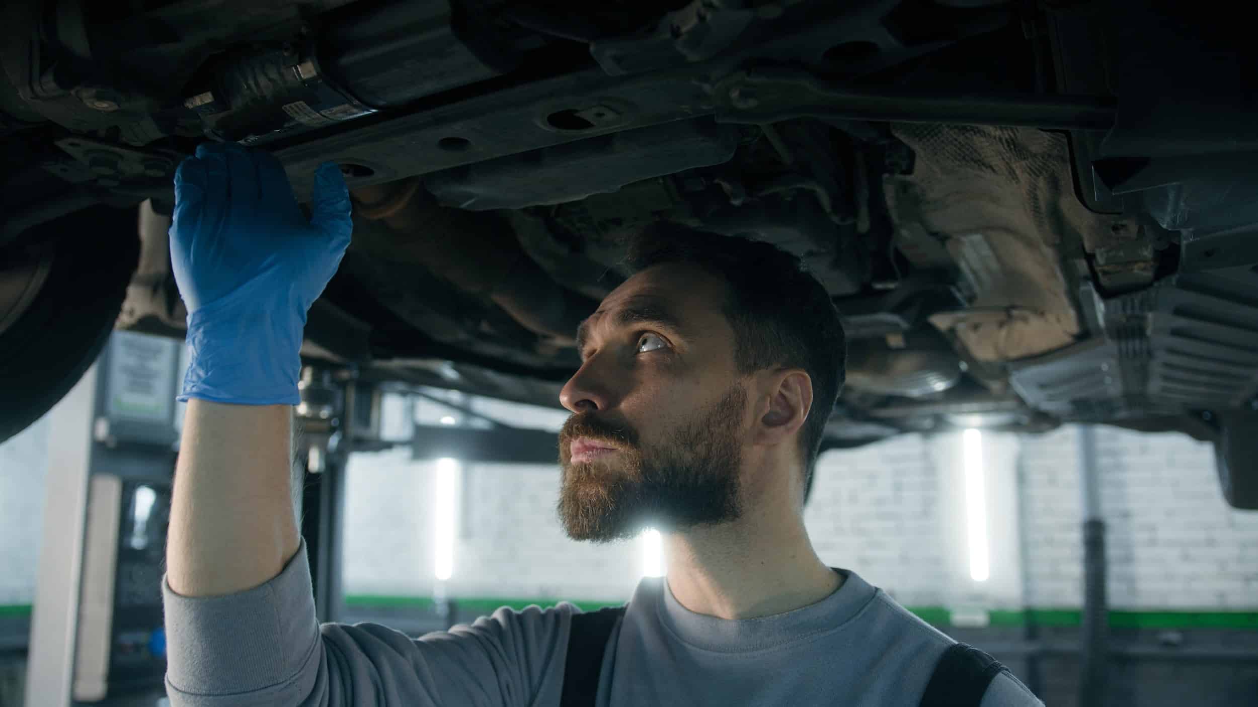Service director reviewing warranty labor rate reports at an automotive dealership